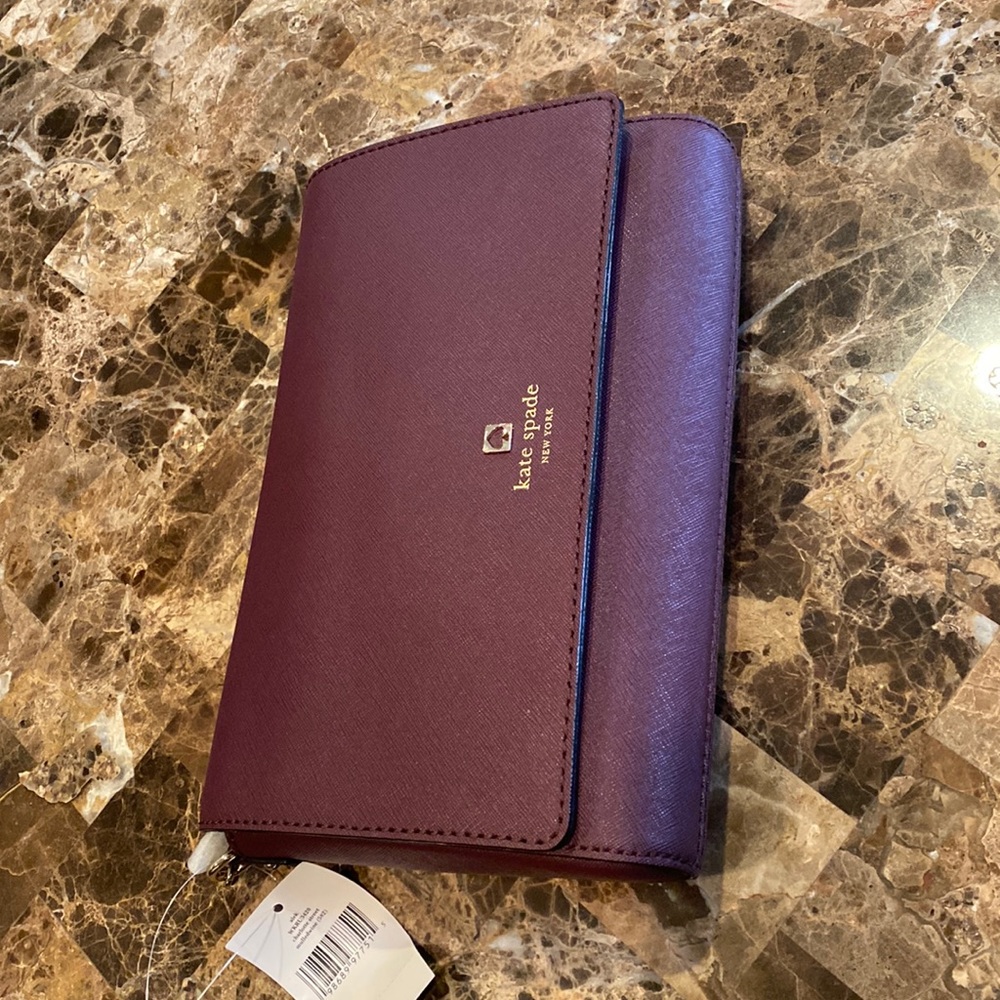 NWT kate spade Bag. Deep maroon color. Inside zippered pocket.